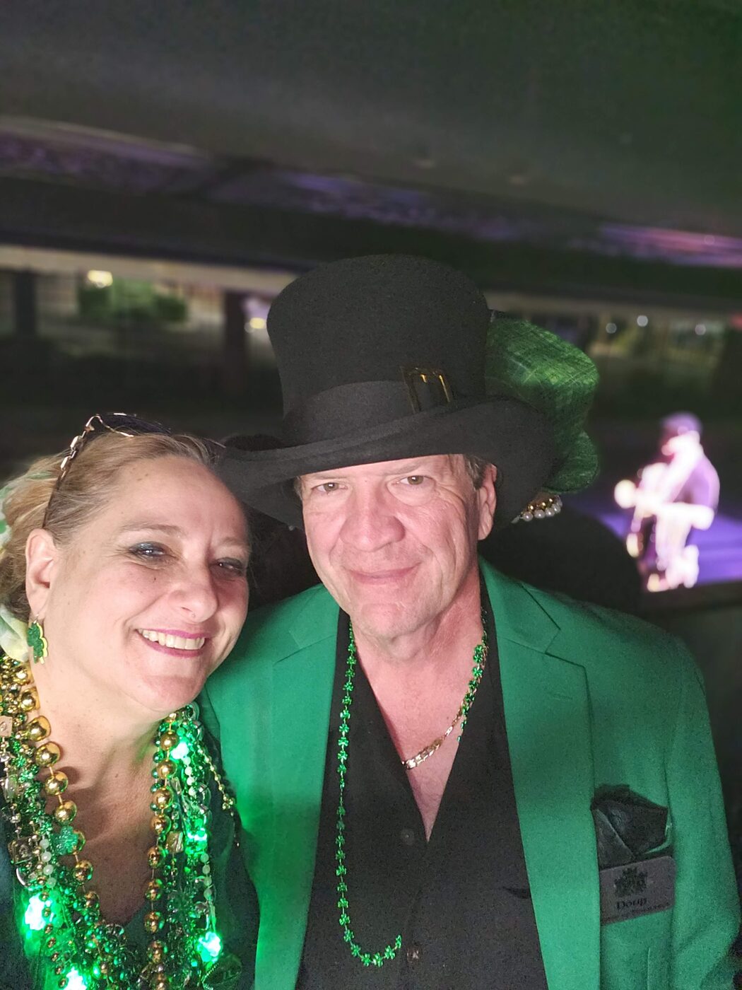 A couple of Krewe members, one in a festive hat