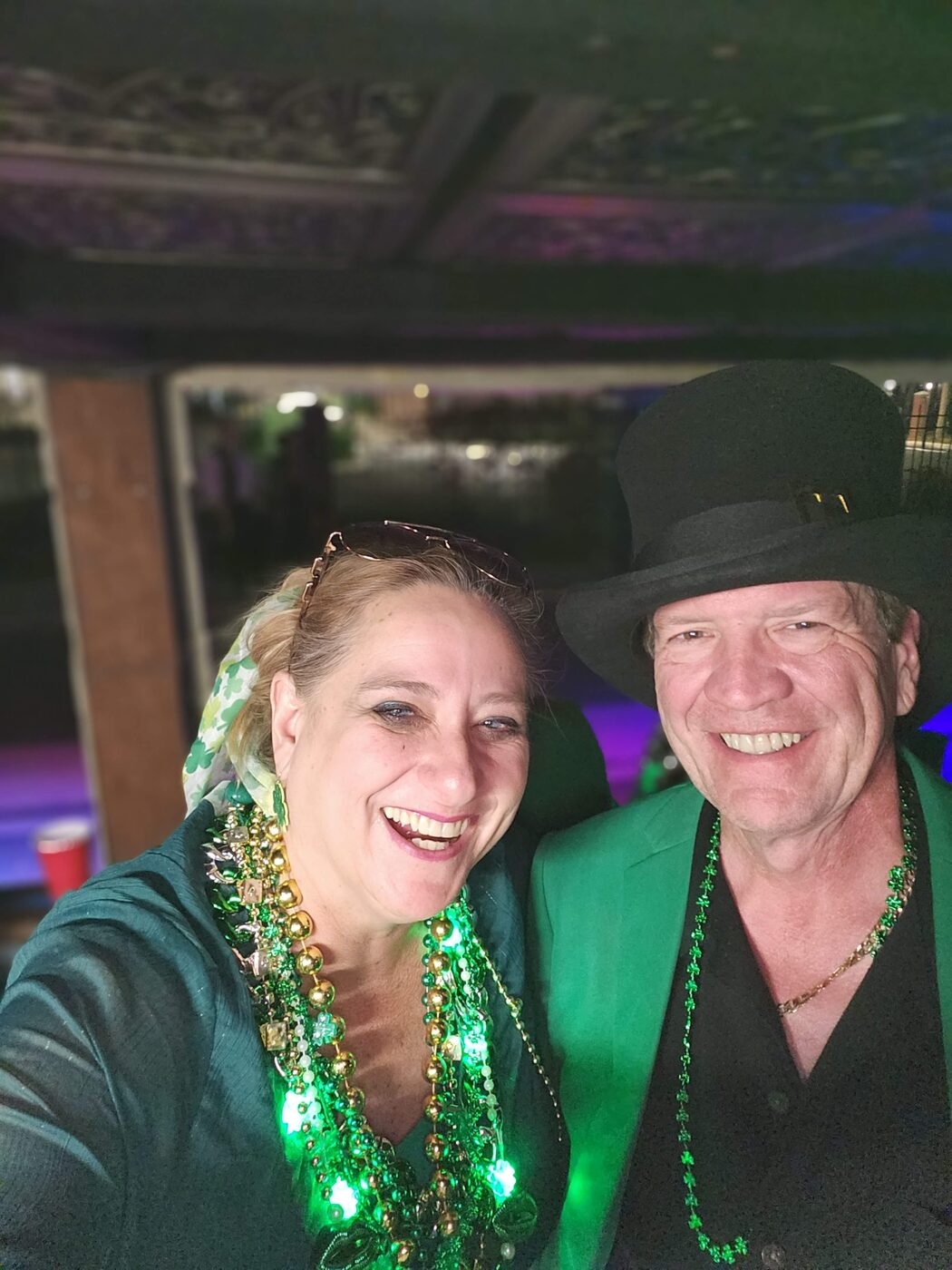 Two Krewe members smiling at a celebration