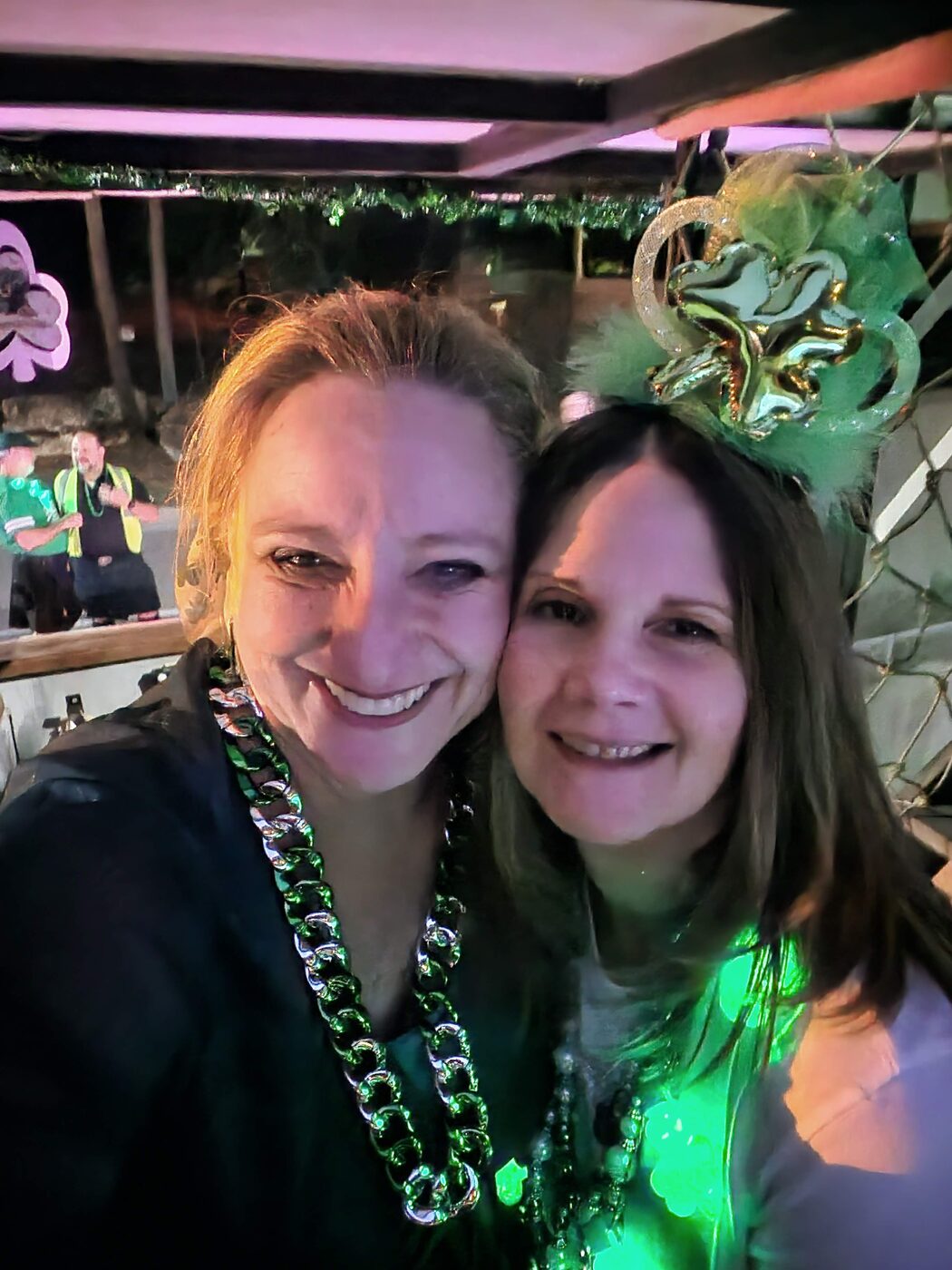 Krewe members wearing green beads