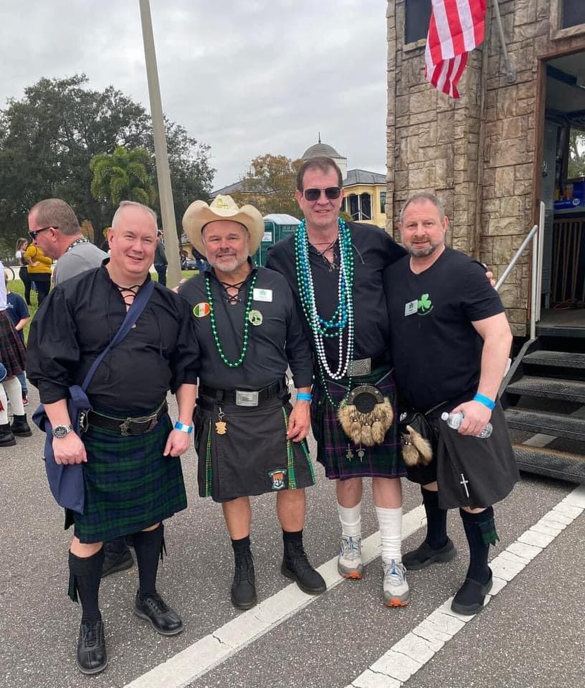 Krewe of Shamrock members in kilts gathered before a parade