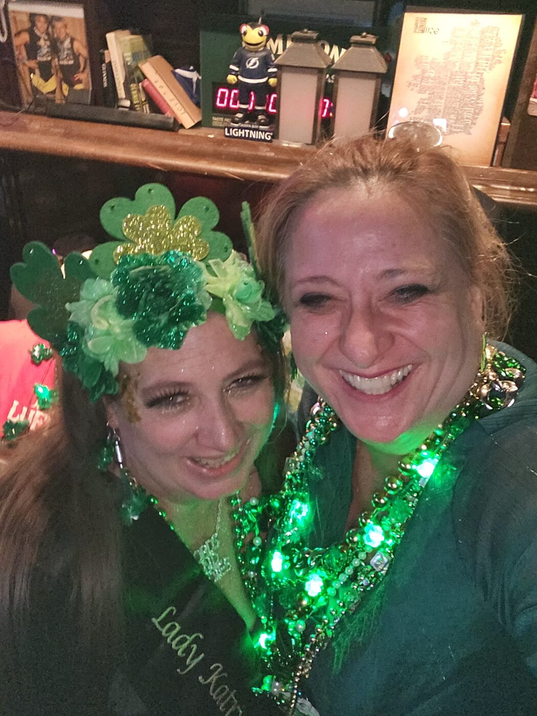 Krewe member decked out in green beads for St. Patrick's Day